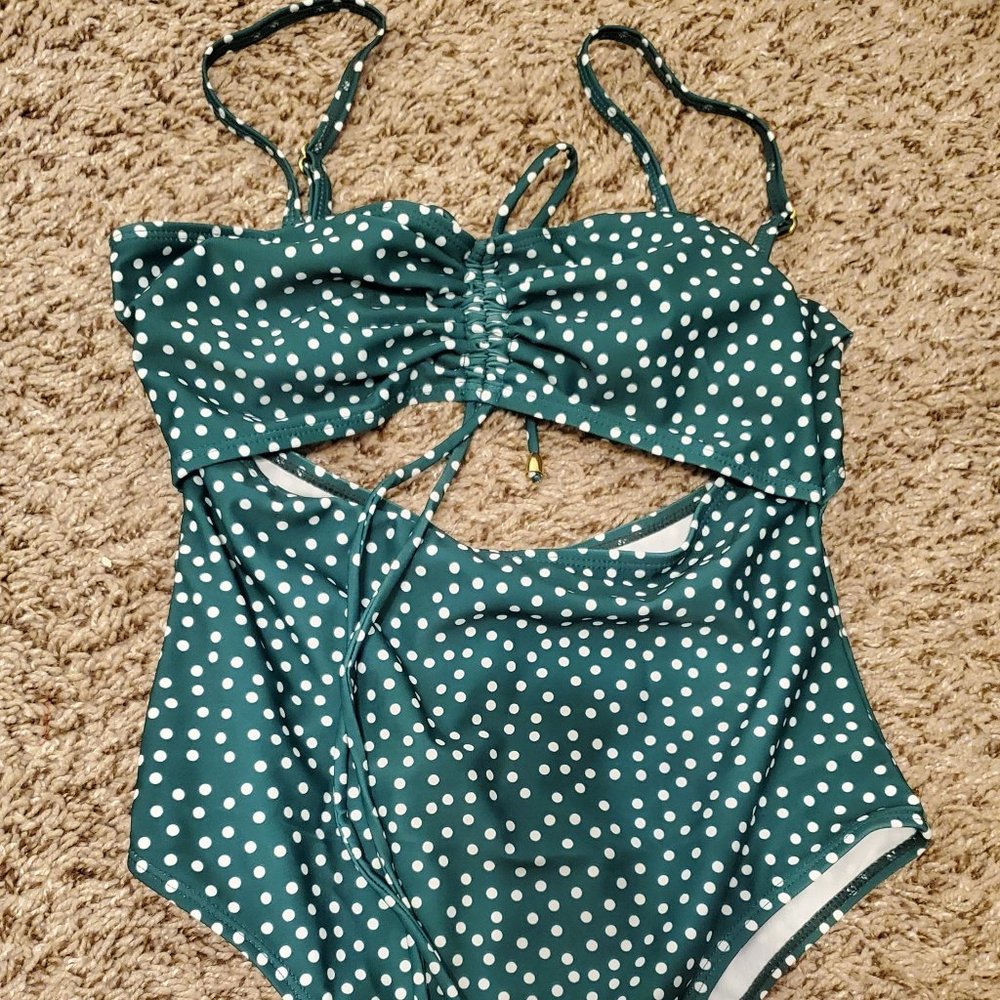 Green and white bathing suit